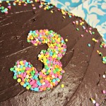 decorating a cake with cookie cutters